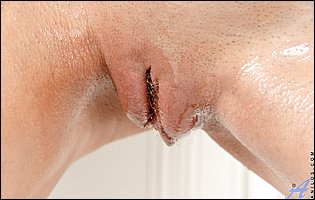 Anee Ocean stripping and teasing with oiled body and pussy in kitchen