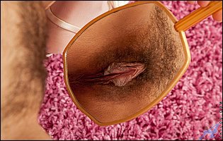 Isabella in sexy lingerie and nylons showing off hairy cunt