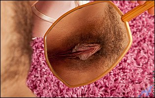 Isabella in sexy lingerie and nylons showing off hairy cunt