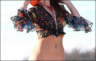 Pretty brunette Lorena Garcia posing on the beach