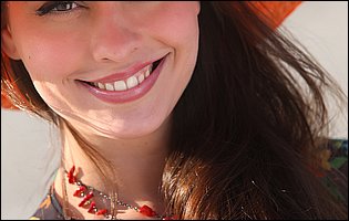 Pretty brunette Lorena Garcia posing on the beach