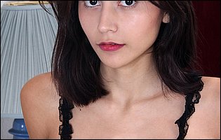 Amelia Pearl in red high heels teasing and playing with a dildo