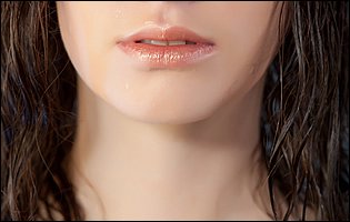 Candy Rose posing in sexy wet blouse and stockings