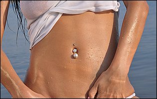 Diva A posing in sexy wet t-shirt and panties on the beach