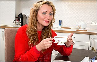 Gorgeous blonde Maya Konovalenko getting nude in the kitchen