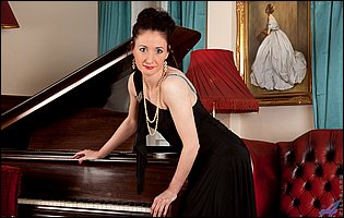 Stacey Robinson in sexy lingerie and stockings spreading her cunt